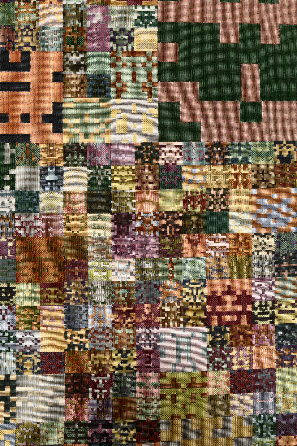 A close view of the woven textile and its repeated geometric motifs.
