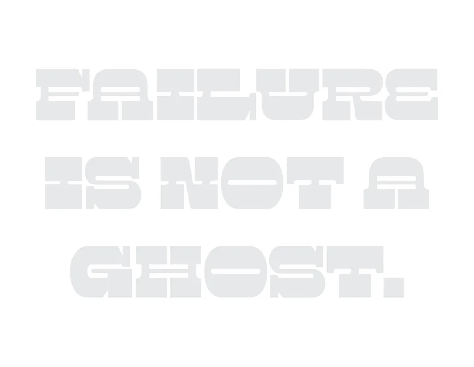 Pale gray lettering on white reads: Failure is not a ghost.