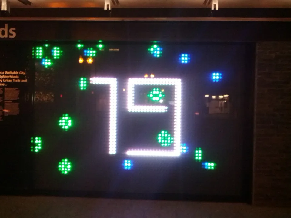 A glowing digital display with colored cells and the number 79 in Life: 44013