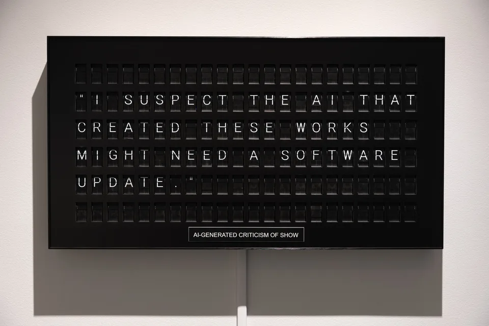 The black split-flap board displays a generated criticism about the AI needing a software update.