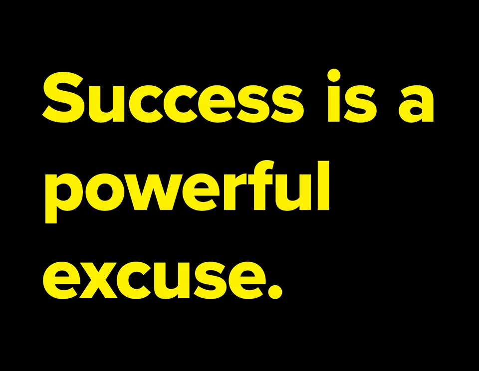 Yellow lettering on black reads: Success is a powerful excuse.