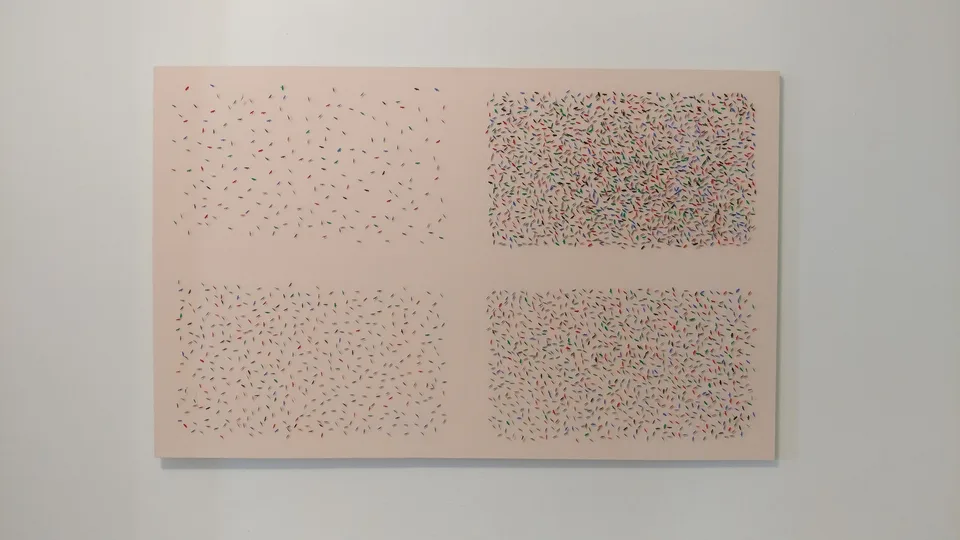 Four fields of small colored tagging attachments arranged on a white canvas