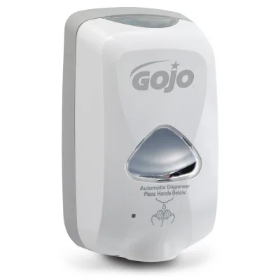 A white automatic GOJO hand-sanitizer dispenser