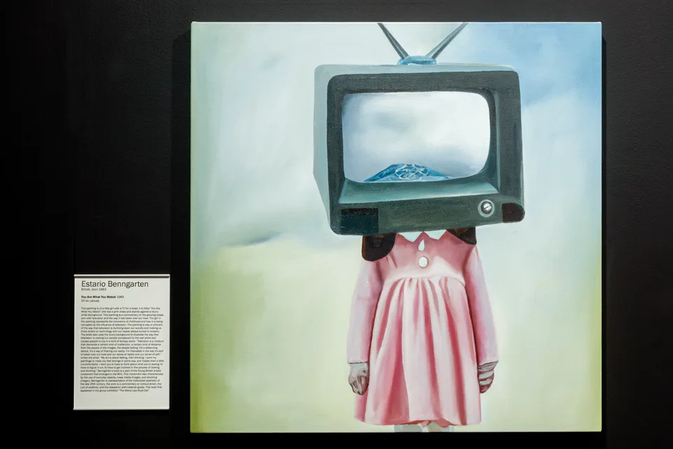 A painting of a pink-dressed figure with a television for a head hangs beside its generated wall label.
