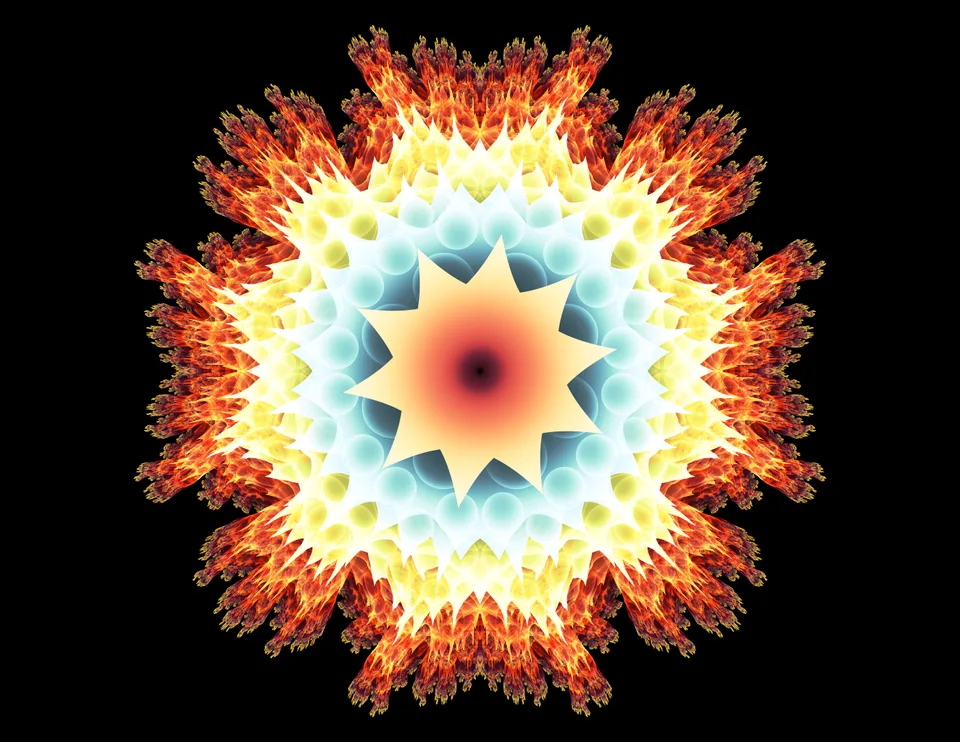 A yellow-orange star-shaped center is surrounded by pale blue repeating curves and an intricate orange outer ring on black.