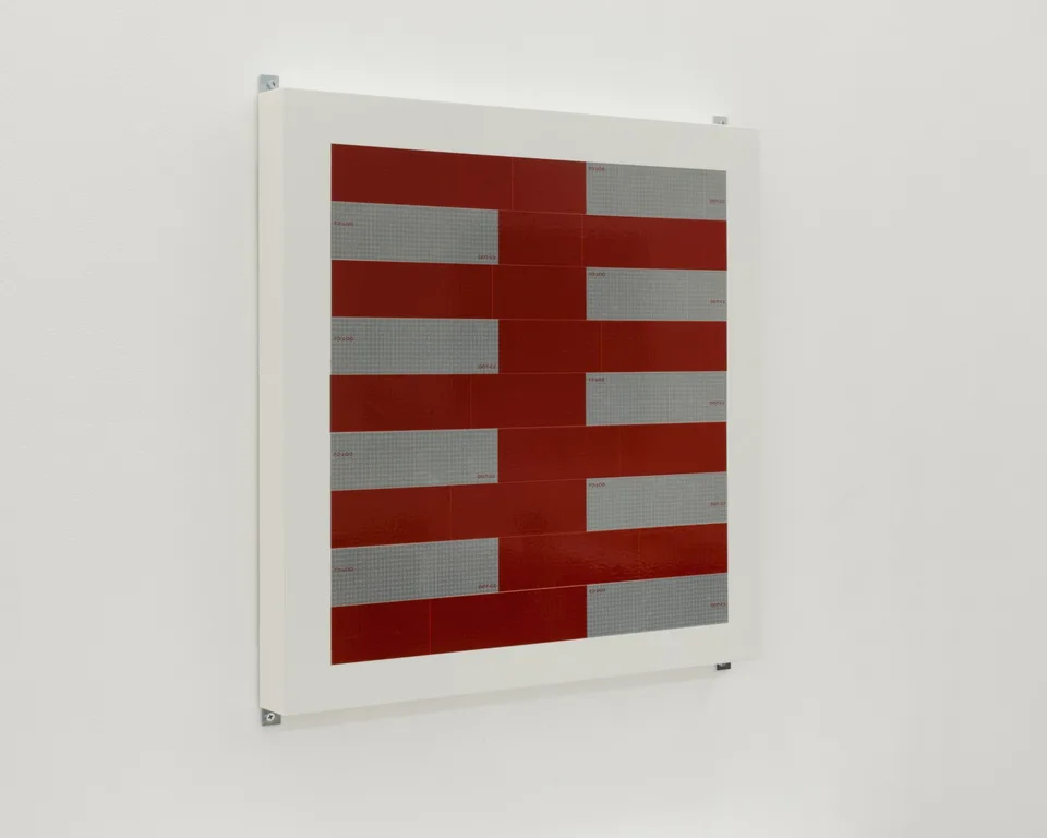 Angled view of a panel of red and silver strips