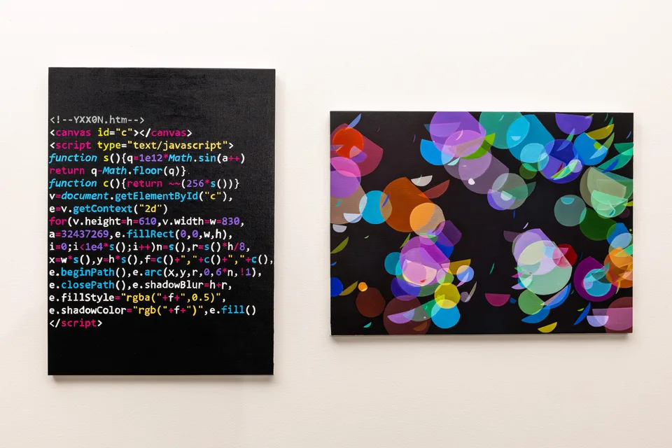 A painting of colorful computer code hangs beside a painting of overlapping translucent circles.