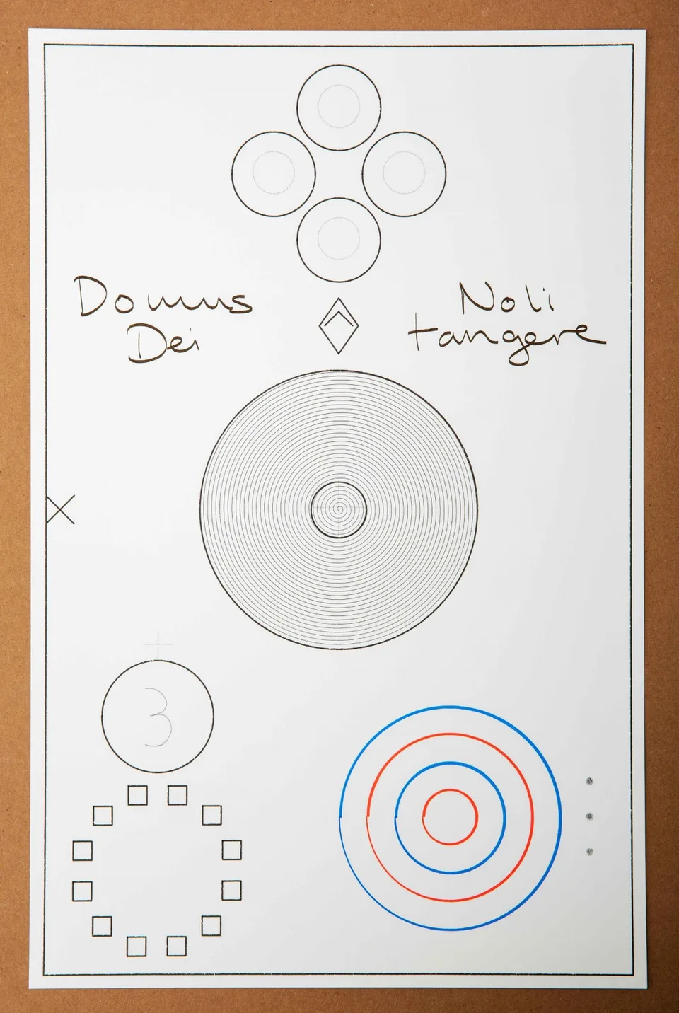 A drawing on white paper arranges black spirals and geometric shapes with red and blue circles and the words Domus Dei and Noli tangere.