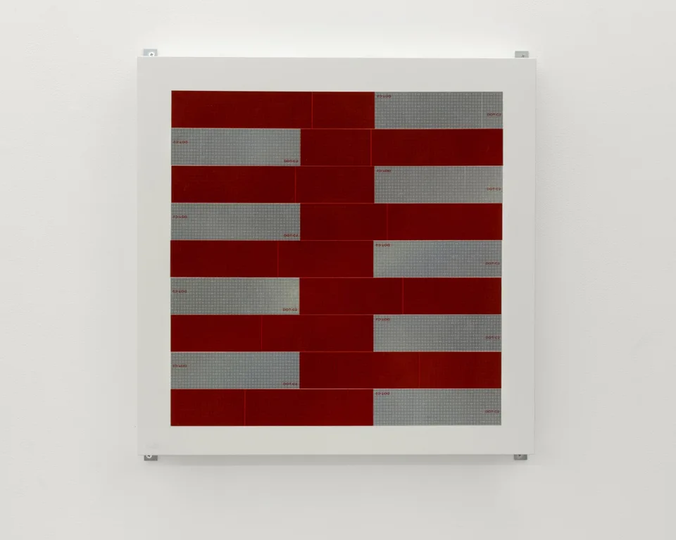 Front view of a composition of red and silver strips