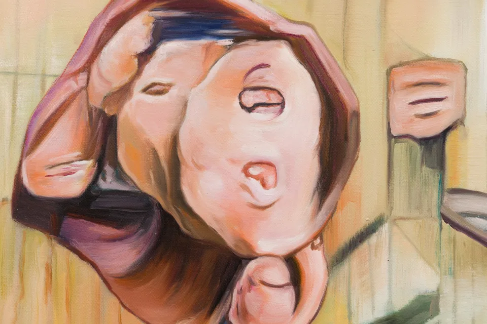 Detail of a painted figure with closed eyes, doubled facial forms and rounded limbs.