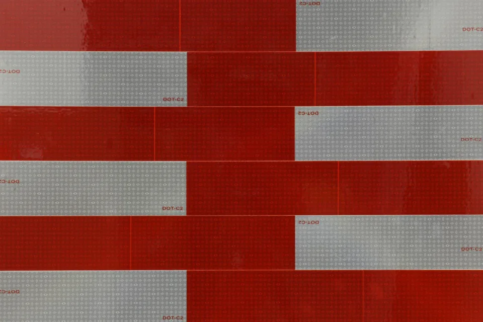 Close view of a composition of red and silver strips