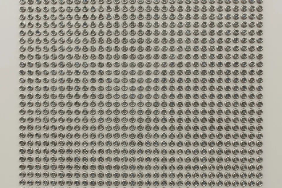 Close view of repeated metallic domes in a regular grid