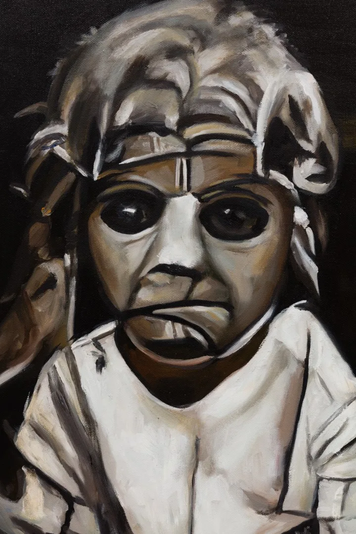 Detail of a gray painted face with dark eyes, angular outlines and pale hair.