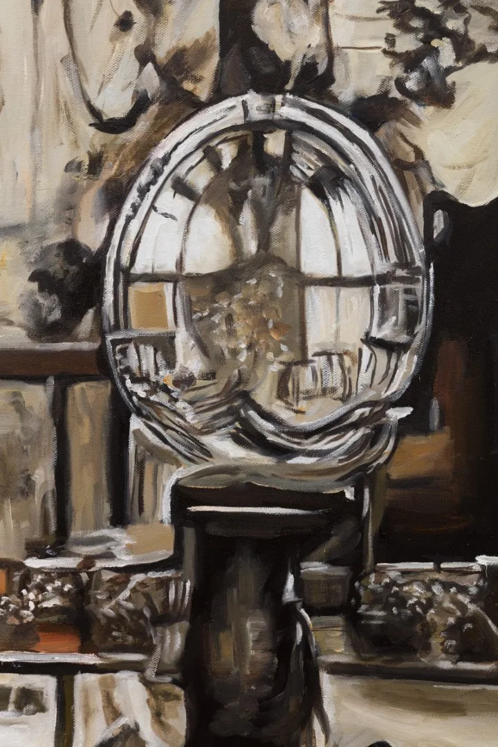 Detail of a painted circular mirror-like object and surrounding gray interior shapes.