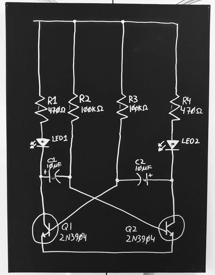 A full view of a painted schematic with two transistors, resistors, capacitors, and LEDs